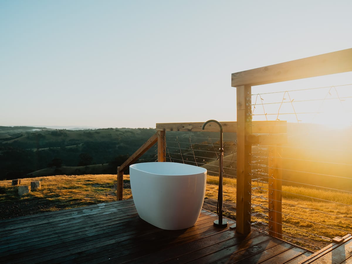 Outdoor bathtub with valley views